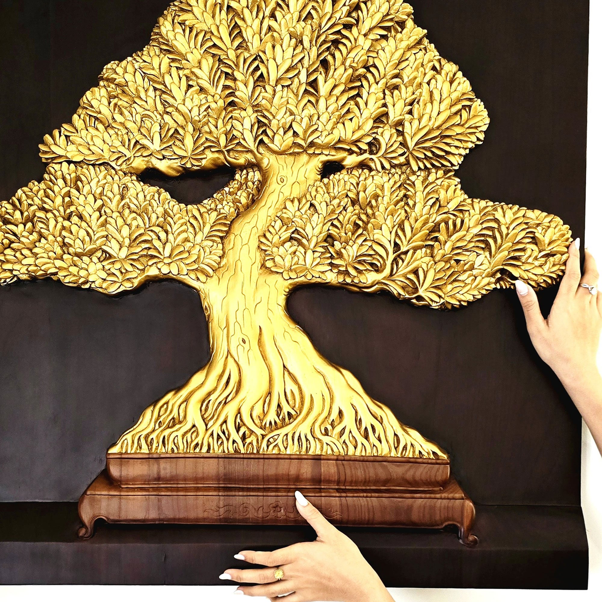The Gilded Harmony Bonsai sculpture installed in a luxury living room; premium Feng Shui wall art by Easternada.