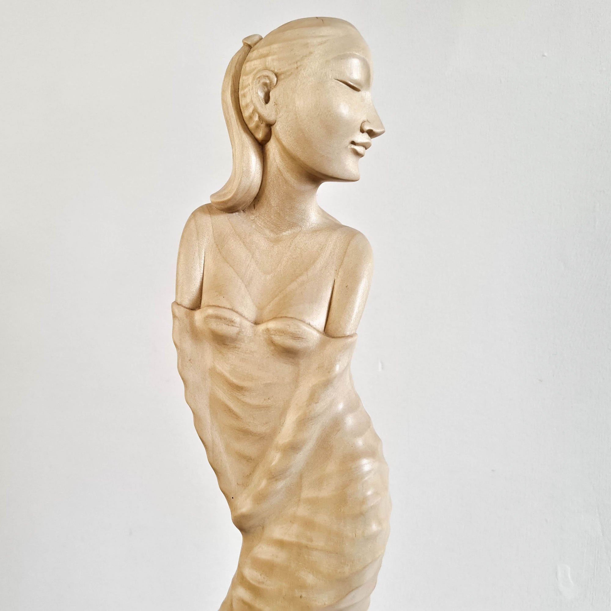 "Lady Chatterley" is a tale of repression, lust, and sexual liberation set in post-World War I France. This beautiful hand-carved sculpture has been hand-crafted by our skilled carvers using the rarest tulip white wood. Its intricate carving is detailed to perfection and is a true masterpiece to grace any interior space. It certainly can be used as a unique gift for a loved one to express your deeper love.