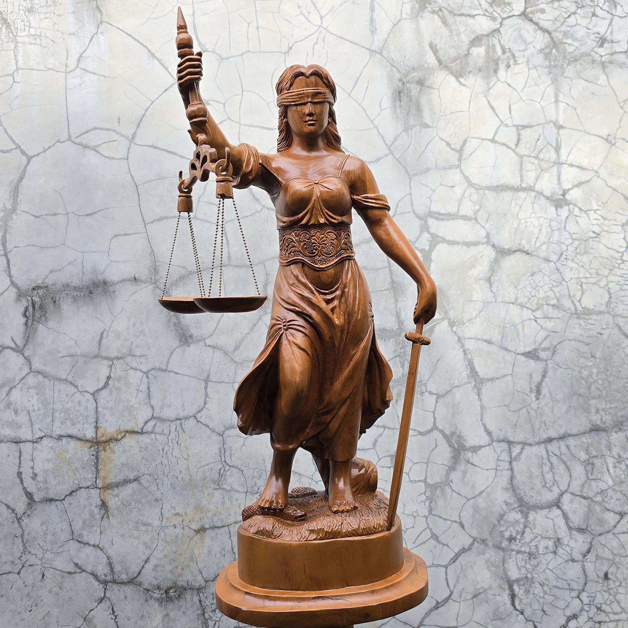 Hand-carved out of solid teakwood, this Lady Justice Greek Goddess sculpture is unique and rare.