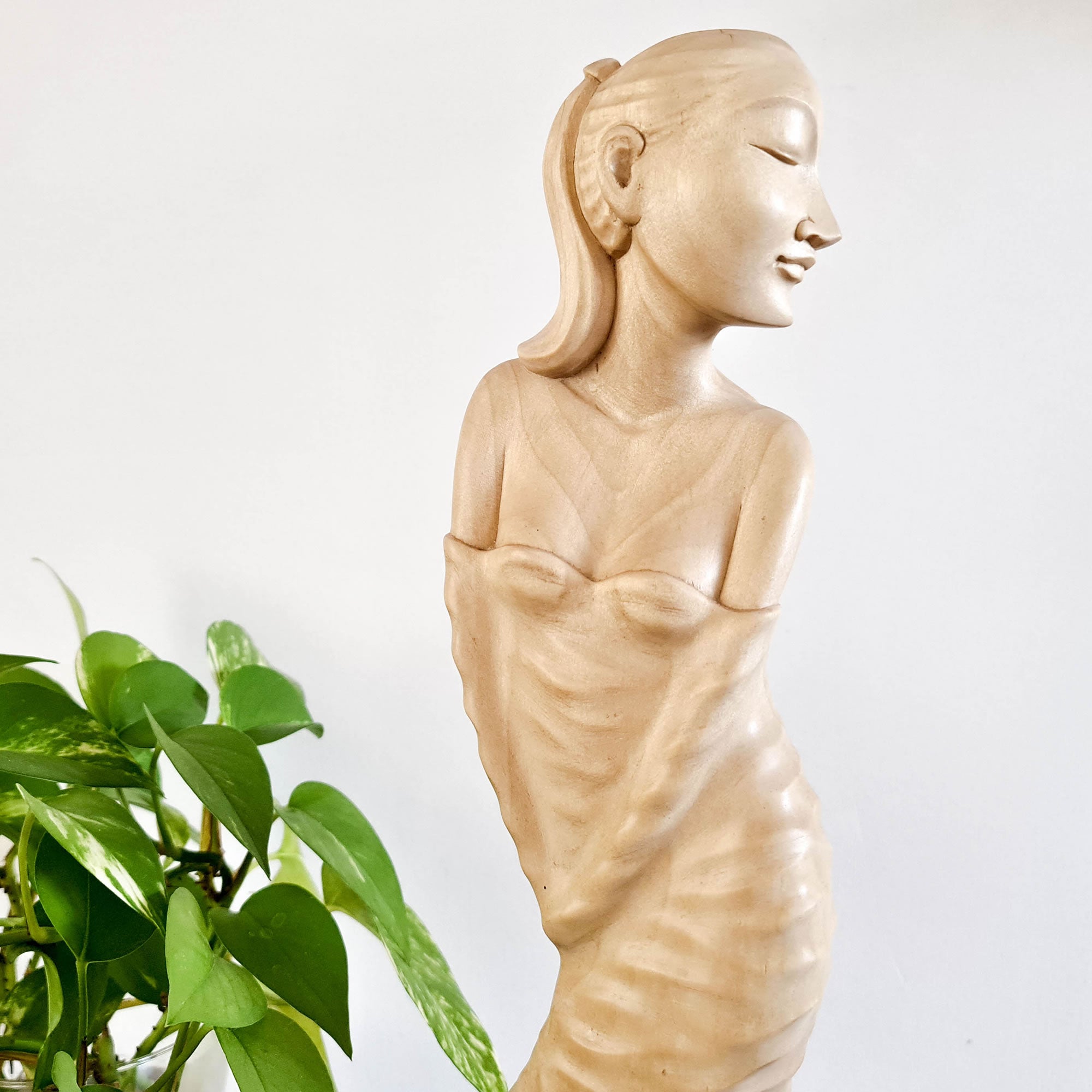 "Lady Chatterley" is a tale of repression, lust, and sexual liberation set in post-World War I France. This beautiful hand-carved sculpture has been hand-crafted by our skilled carvers using the rarest tulip white wood. Its intricate carving is detailed to perfection and is a true masterpiece to grace any interior space. It certainly can be used as a unique gift for a loved one to express your deeper love.