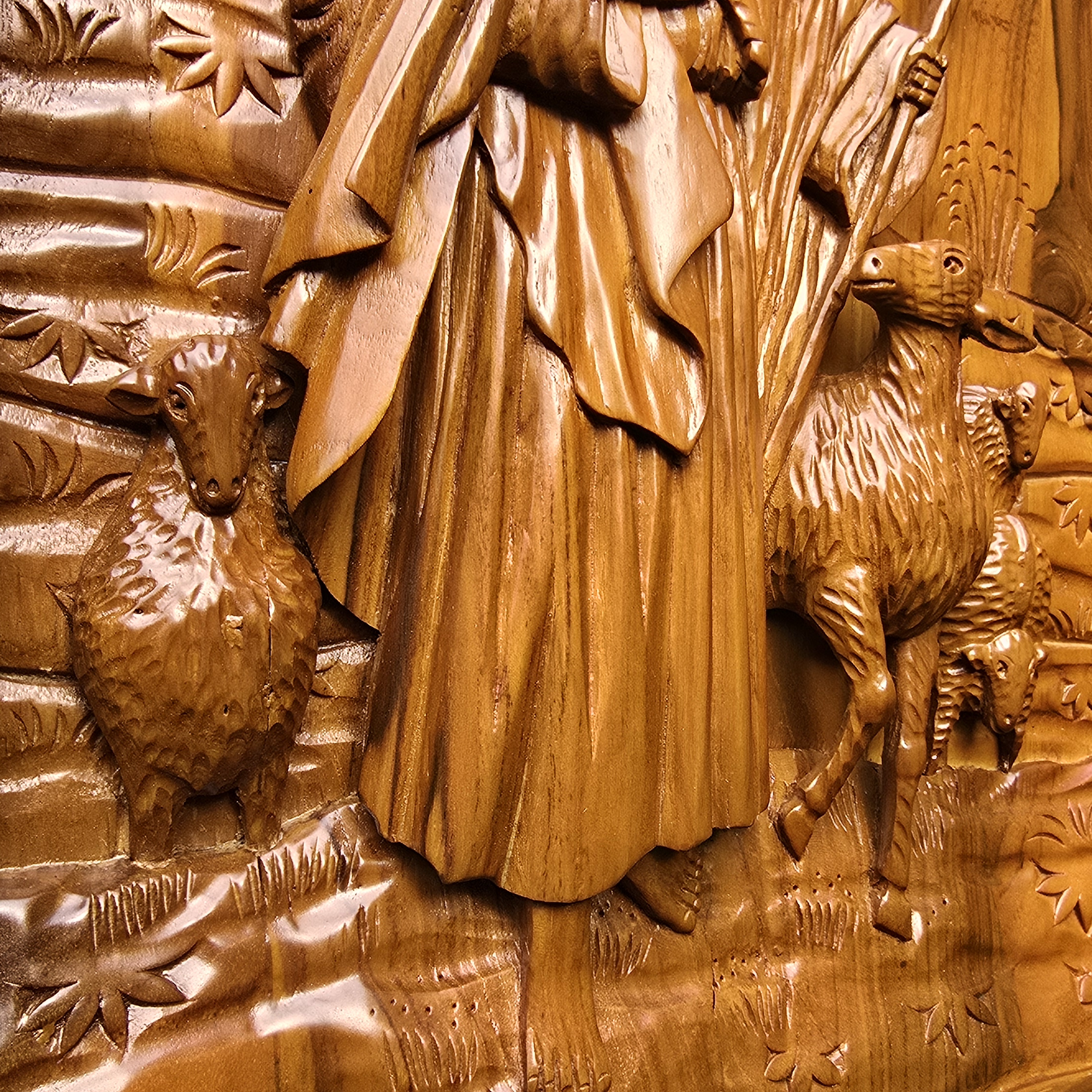 Carved wooden panel with a shepherd and sheep