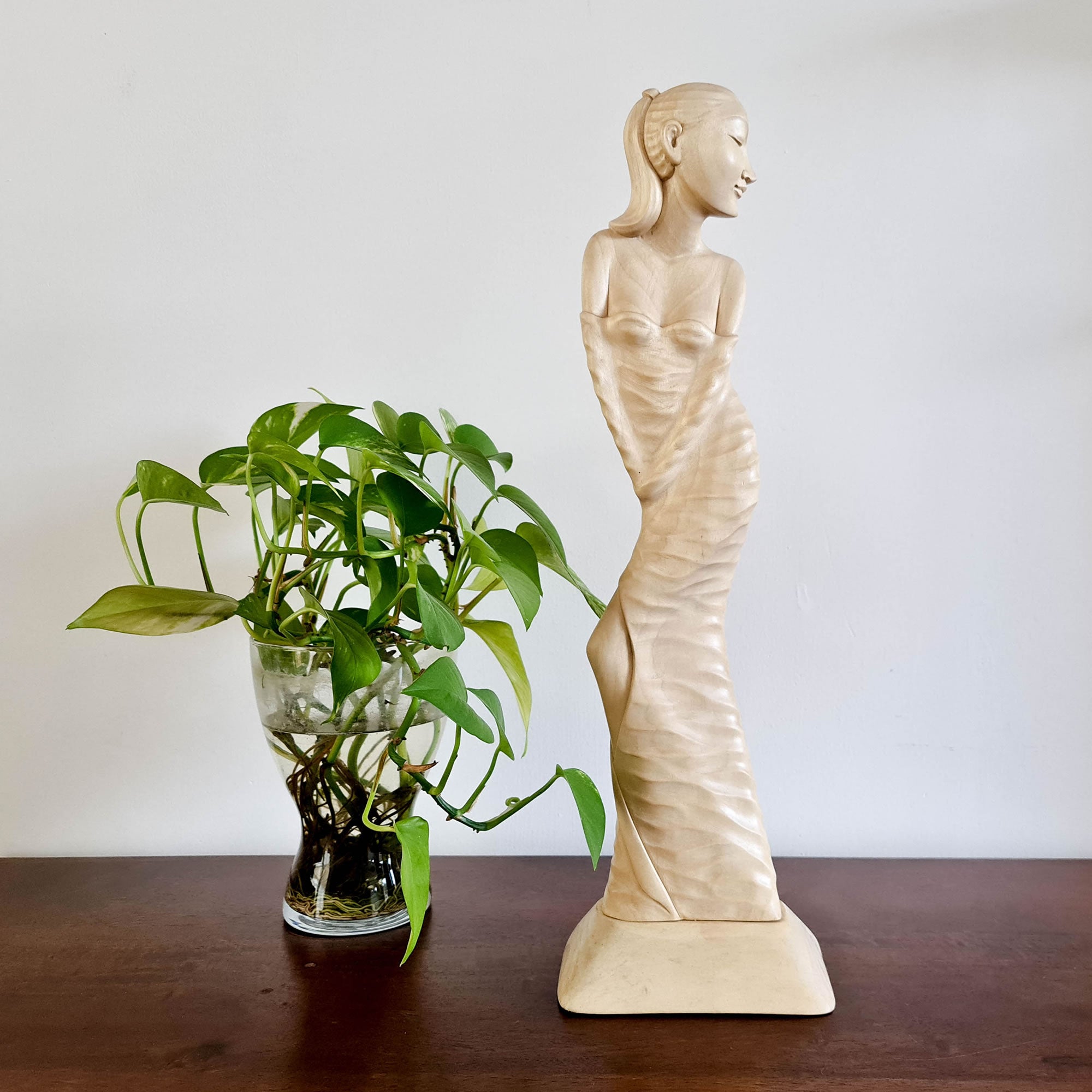 "Lady Chatterley" is a tale of repression, lust, and sexual liberation set in post-World War I France. This beautiful hand-carved sculpture has been hand-crafted by our skilled carvers using the rarest tulip white wood. Its intricate carving is detailed to perfection and is a true masterpiece to grace any interior space. It certainly can be used as a unique gift for a loved one to express your deeper love.