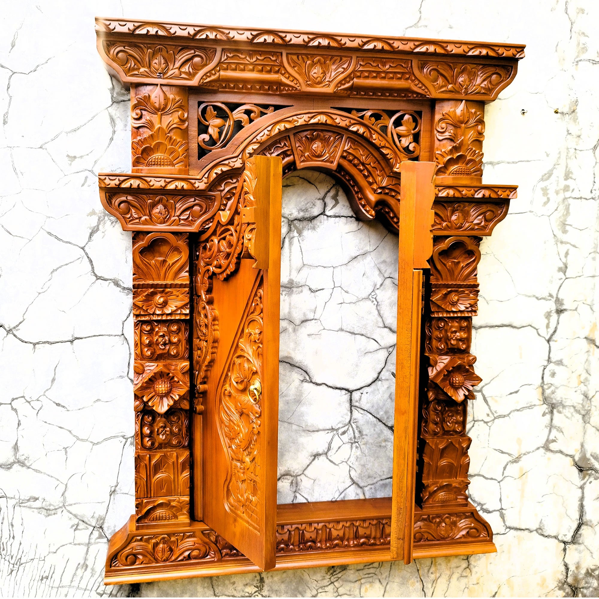 Full view of the teakwood Gebyok sculpture with doors open, highlighting the functional hinges and deep 3D relief carving