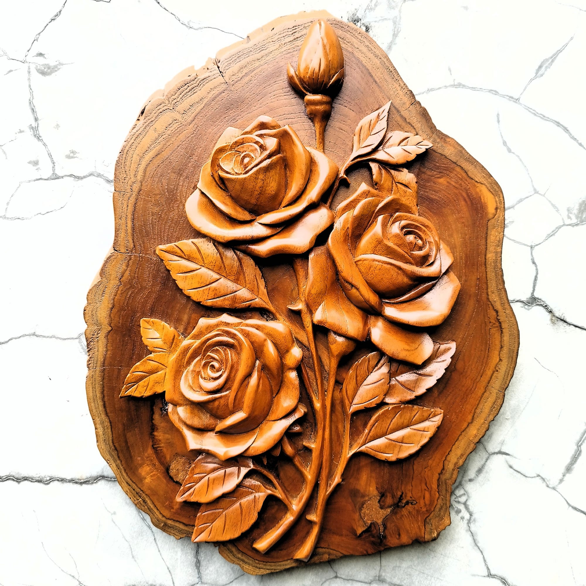 Front view of a hand-carved solid teakwood rose bouquet wall art, showing intricate floral detailing and the natural wood grain of the 40cm sculpture