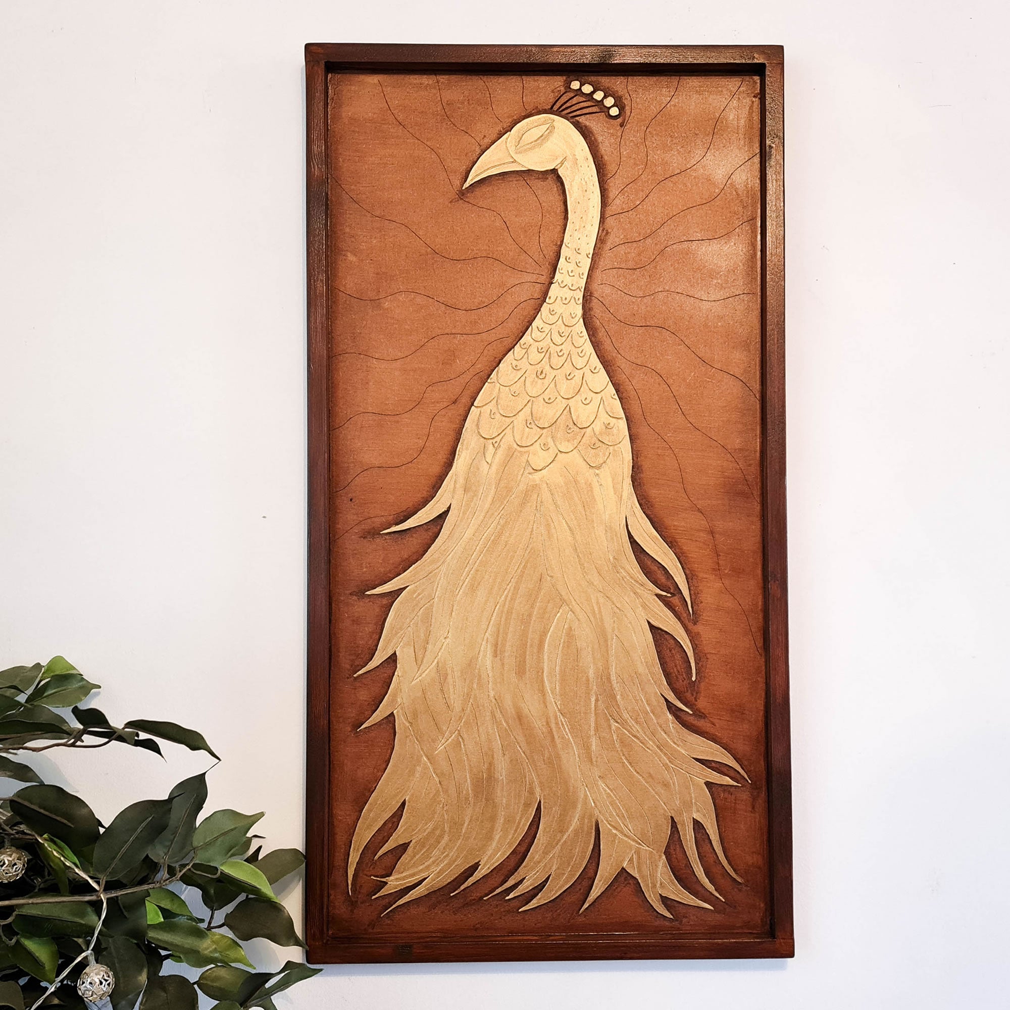 A beautifully carved wooden wall art - Golden Peacock. Handcrafted by skilled craftsmen this one-off piece is unique and simply amazing.