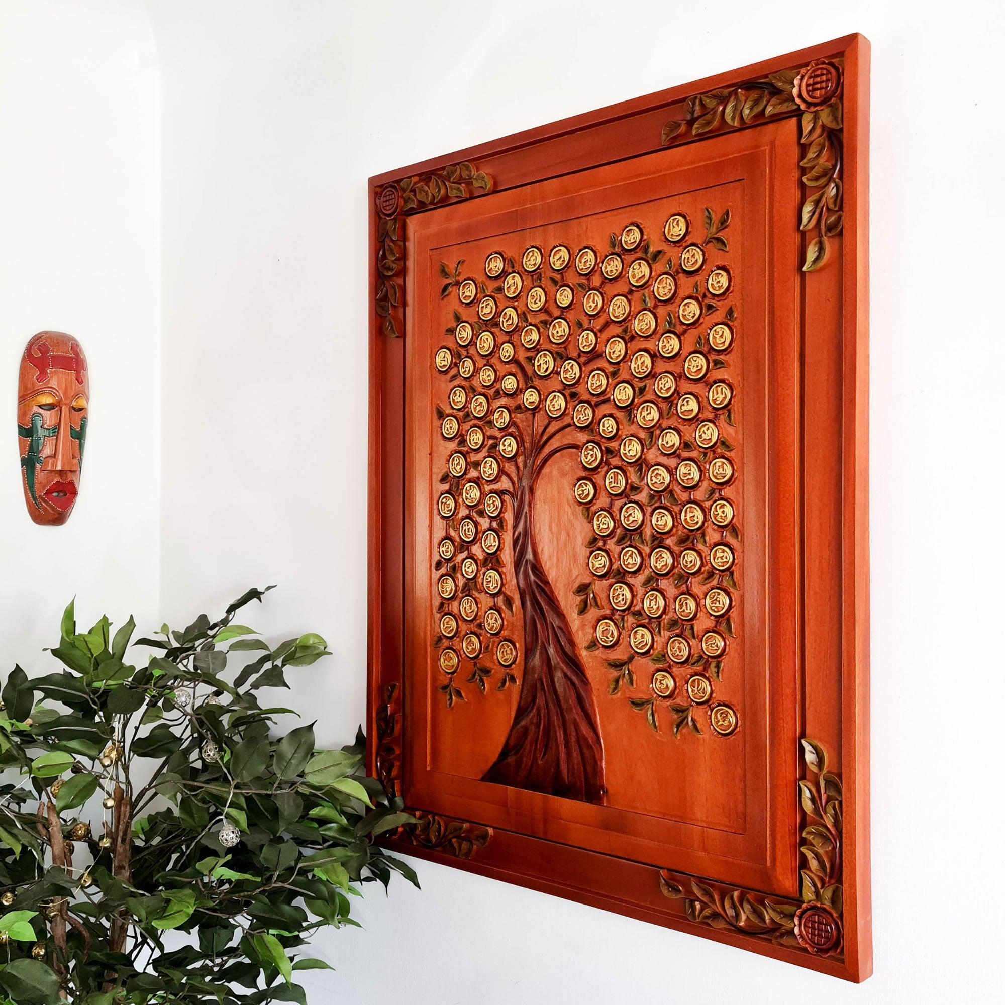 Monumental Asmaullah il Husna Tree of Life wall art installed in a luxury living room; hand-carved teakwood Islamic calligraphy with hand-painted gold detail.
