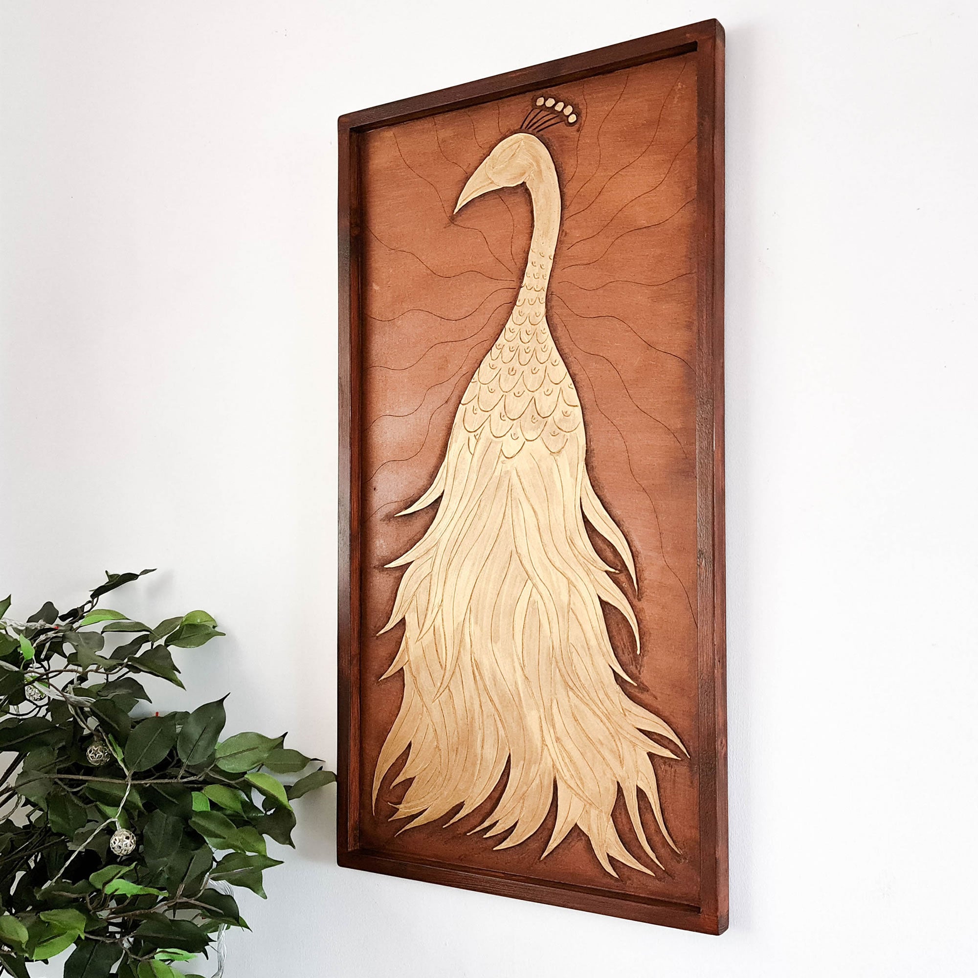 A beautifully carved wooden wall art - Golden Peacock. Handcrafted by skilled craftsmen this one-off piece is unique and simply amazing.
