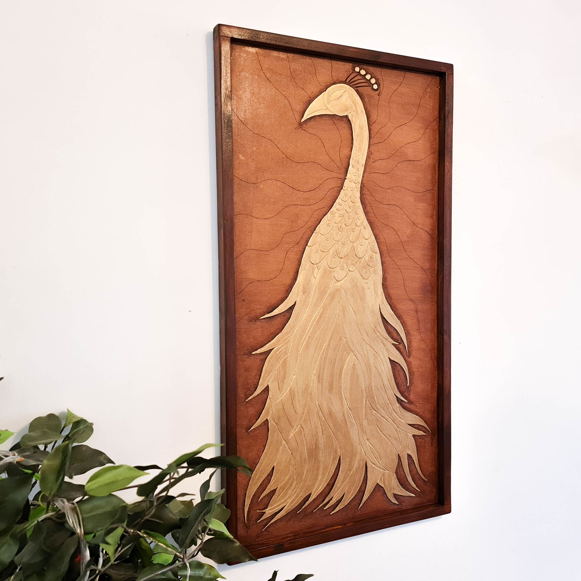A beautifully carved wooden wall art - Golden Peacock. Handcrafted by skilled craftsmen this one-off piece is unique and simply amazing.