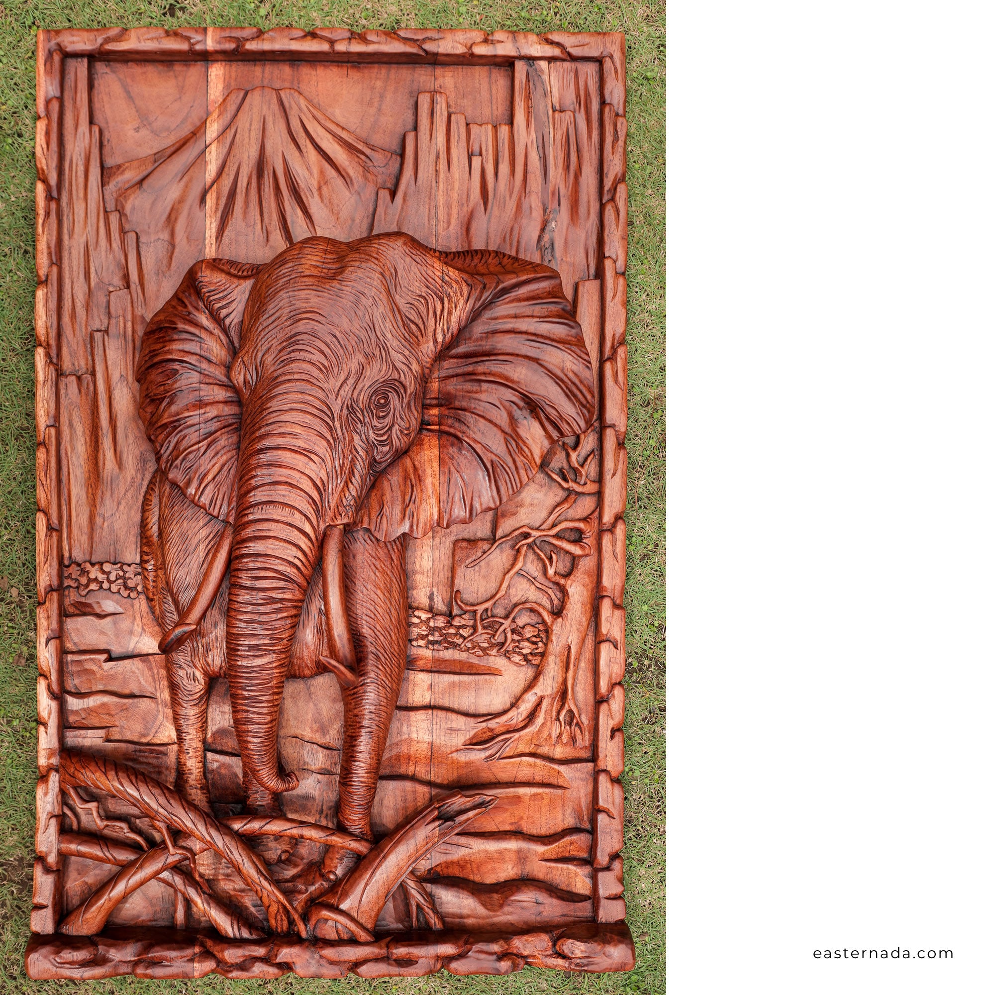 This stunning hand-carved African elephant is undoubtedly a masterpiece. Carved out of solid teakwood, the carver has captured the raw majestic nature of the African elephant in its environment. A wood art that will adorn the walls and become a focal point in any room.