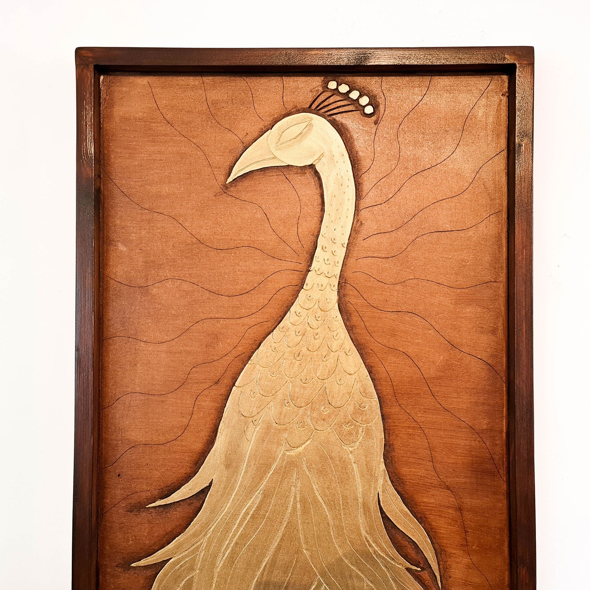 A beautifully carved wooden wall art - Golden Peacock. Handcrafted by skilled craftsmen this one-off piece is unique and simply amazing.