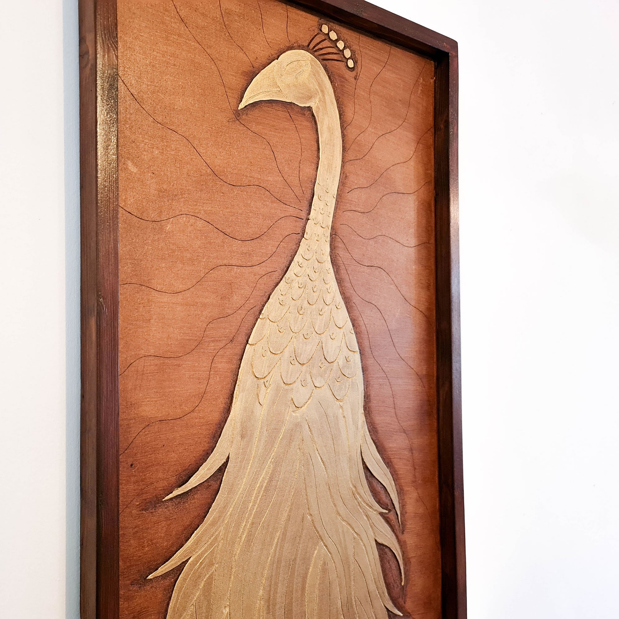 A beautifully carved wooden wall art - Golden Peacock. Handcrafted by skilled craftsmen this one-off piece is unique and simply amazing.