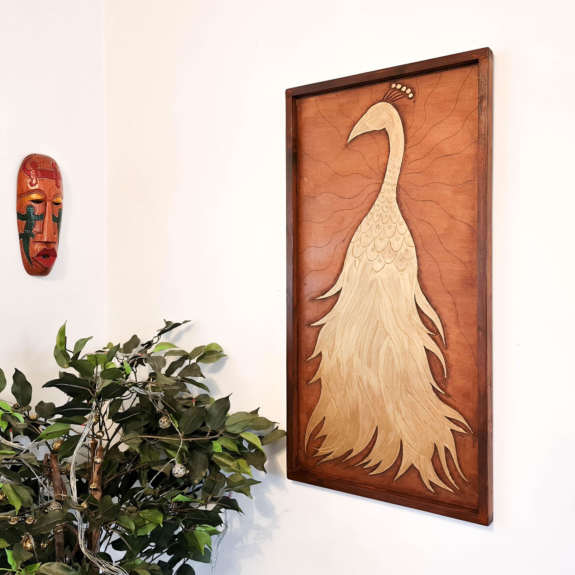 A beautifully carved wooden wall art - Golden Peacock. Handcrafted by skilled craftsmen this one-off piece is unique and simply amazing.