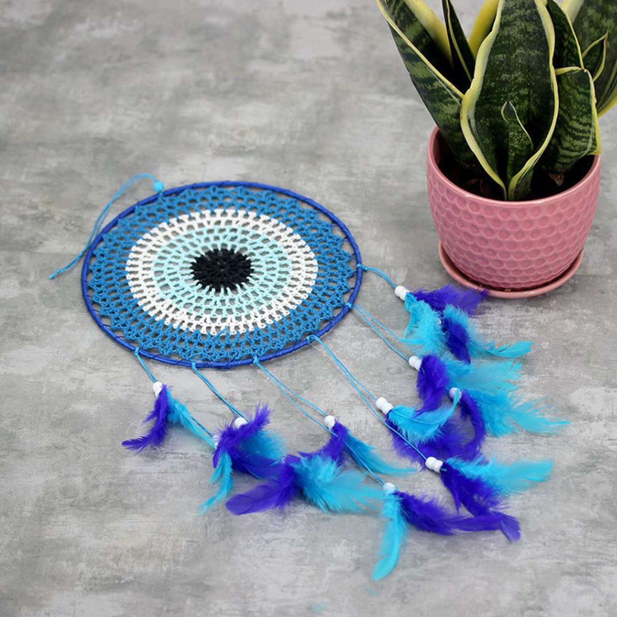 A beautiful Nazar Turkish Evil Eye Handmade Bohemian Macramé Beads Dream Catcher Car Wall Hanging Decoration Art, a perfect gift. A unique piece with subtle colors and beads to give an elegant touch