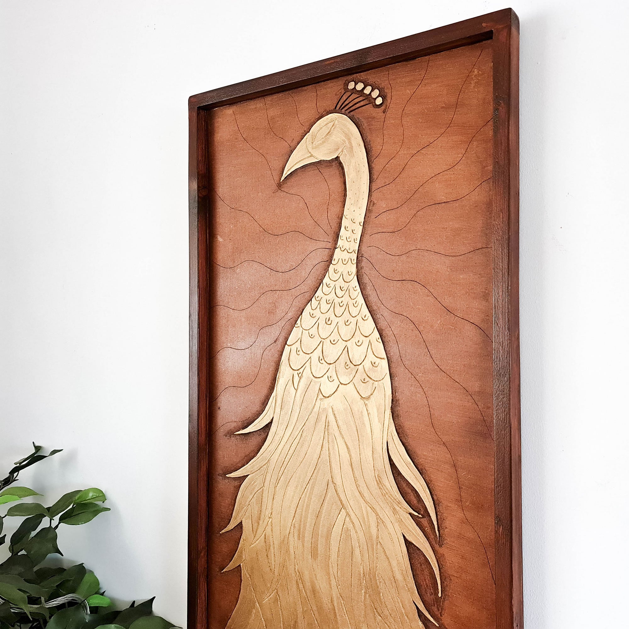 A beautifully carved wooden wall art - Golden Peacock. Handcrafted by skilled craftsmen this one-off piece is unique and simply amazing.