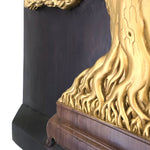 Close-up of hand-painted gold calligraphy-style branches on a 3D teakwood carving; showcasing high-relief artisan detail
