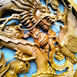 Close-up of the Phoenix bird detailing on the teakwood sculpture, highlighting the intricate hand-carved feathers and wood grain