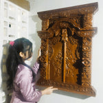 Full view of the teakwood Gebyok sculpture with doors open, highlighting the functional hinges and deep 3D relief carving