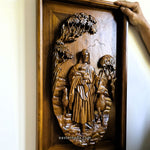 Detailed closeup of solid teak wood carving showing dimensional relief details of Jesus Christ as the sacred shepherd, hand-crafted wall sculpture.