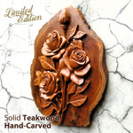 Side view of hand-carved teakwood roses sculpture highlighting the 3D relief carving and the thickness of the solid wood on a gallery wall