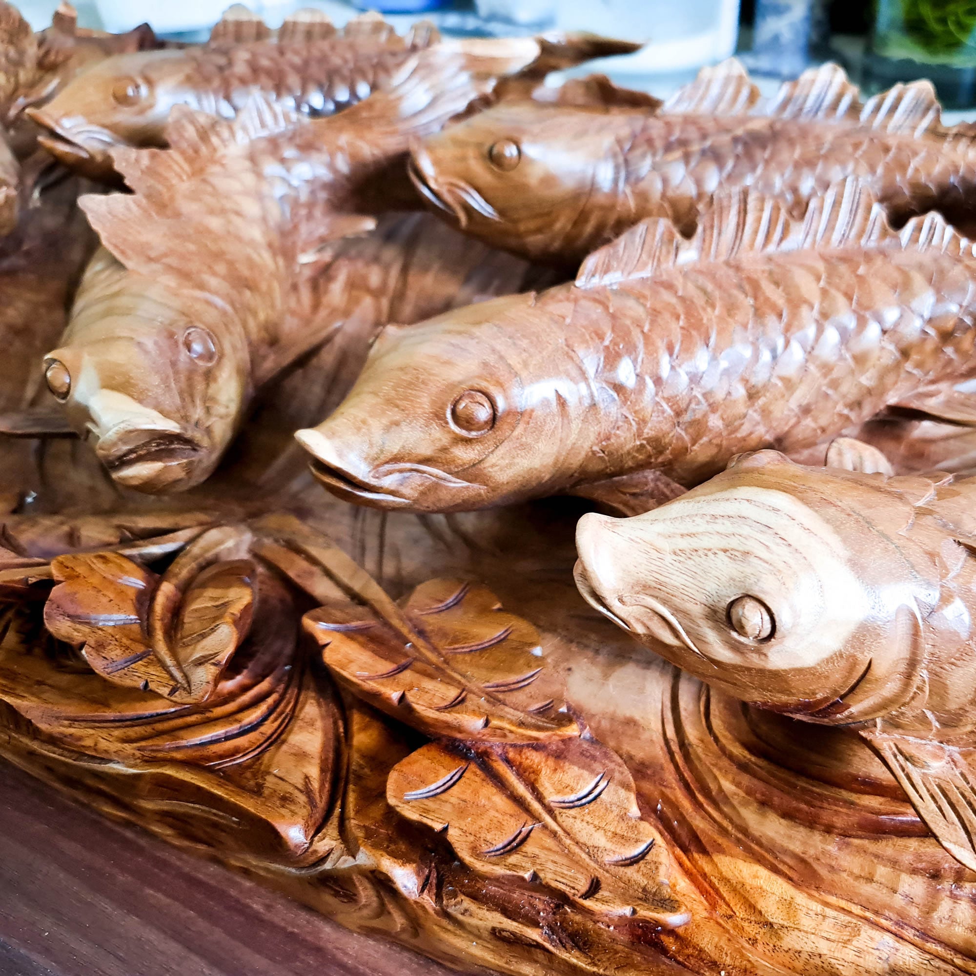 Koi fishes hand carved out of a single piece of Teak wood. Koi fishes represent good luck, prosperity and abundance in Feng Shui. This is a stunning Carved Wooden Wall Art handmade with some eye catching results. An exclusive and unique piece, only one carved and available. A perfect gift.