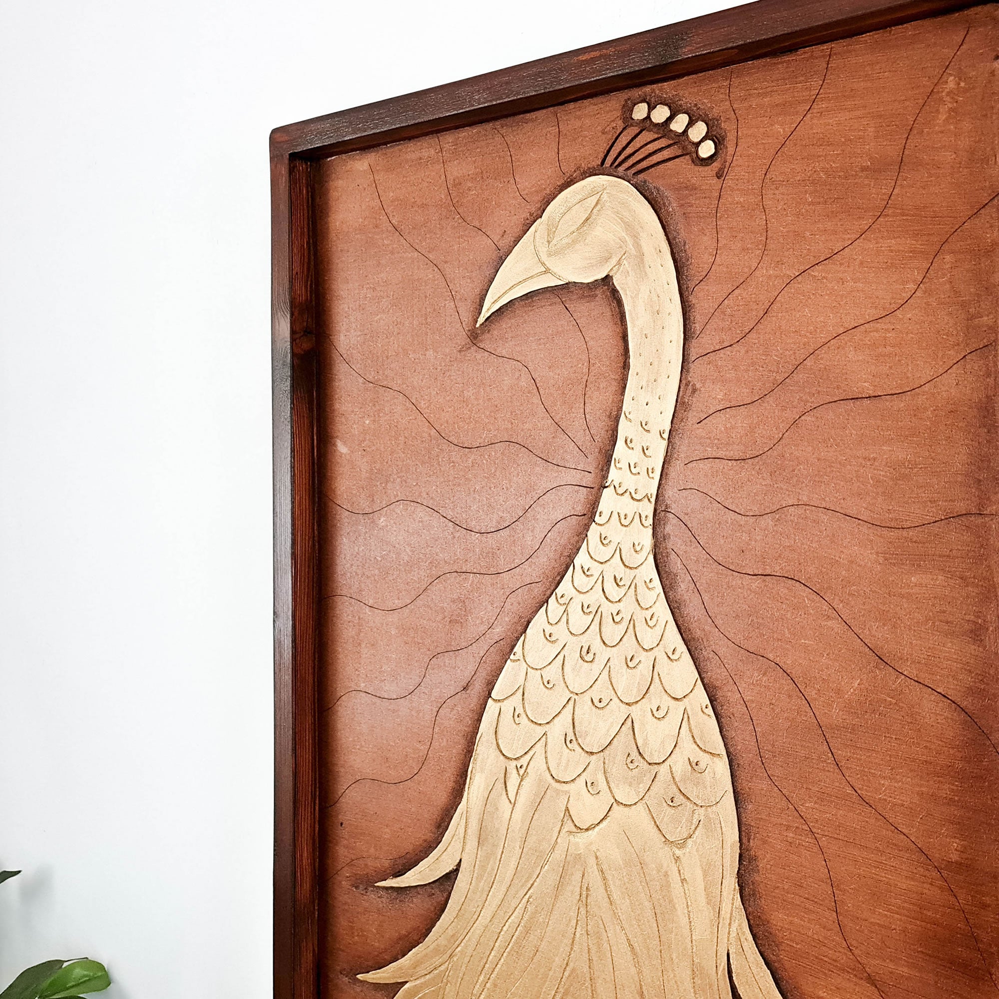 A beautifully carved wooden wall art - Golden Peacock. Handcrafted by skilled craftsmen this one-off piece is unique and simply amazing.