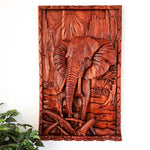 This stunning hand-carved African elephant is undoubtedly a masterpiece. Carved out of solid teakwood, the carver has captured the raw majestic nature of the African elephant in its environment. A wood art that will adorn the walls and become a focal point in any room.