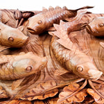 Koi fishes hand carved out of a single piece of Teak wood. Koi fishes represent good luck, prosperity and abundance in Feng Shui. This is a stunning Carved Wooden Wall Art handmade with some eye catching results. An exclusive and unique piece, only one carved and available. A perfect gift.