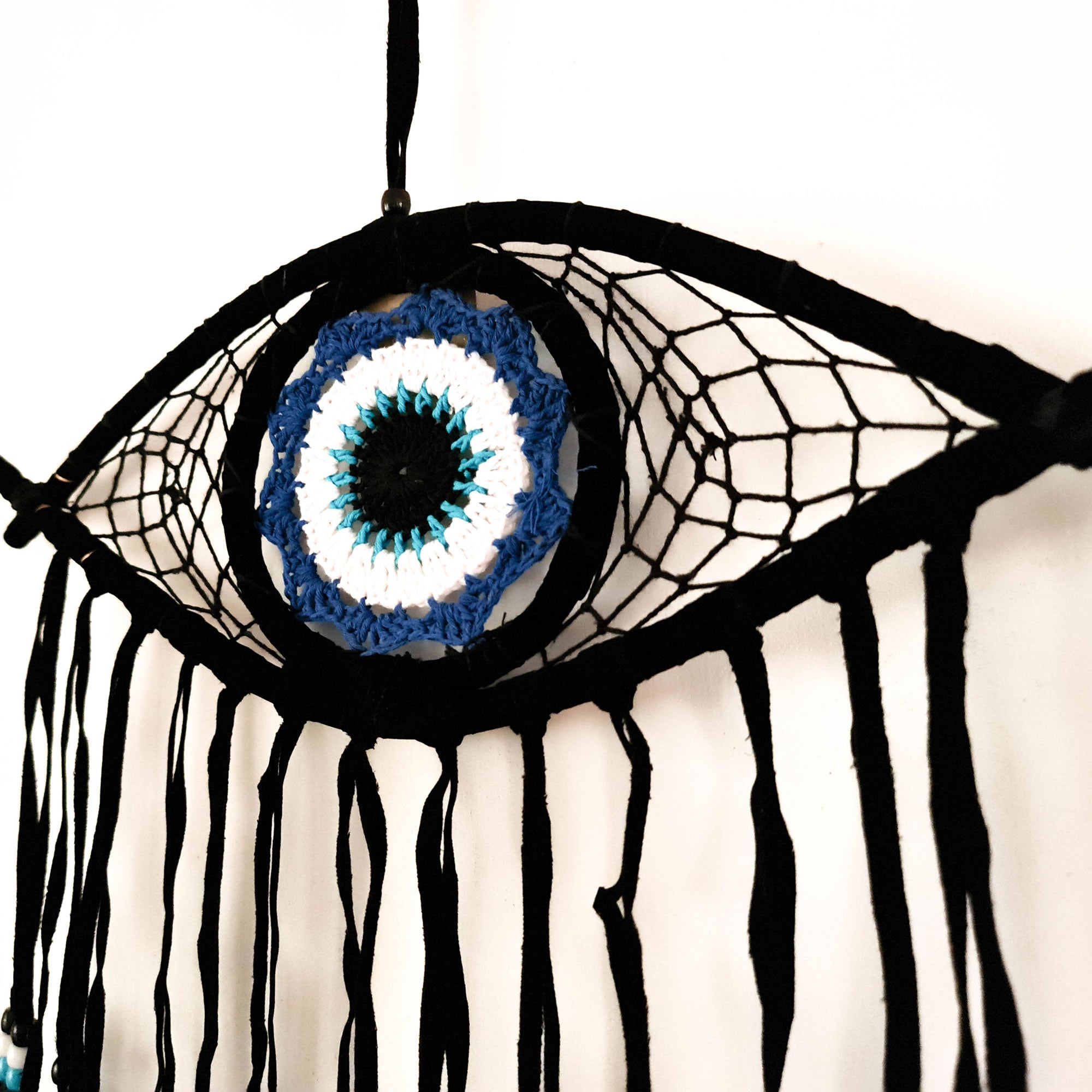A beautiful Nazar Turkish Evil Eye Handmade Bohemian Macramé Beads Dream Catcher Car Wall Hanging Decoration Art, a perfect gift. A unique piece with subtle colors and beads to give an elegant touch.