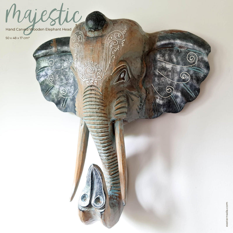 This stunning large hand-carved wooden African Elephant head is simply amazing. Carved out of solid wood by hand with intricate details.